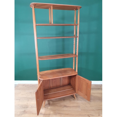 50 - A light elm Ercol 'Giraffe' Room Divider fitted two doors to base, label to inside of cupboard door,... 