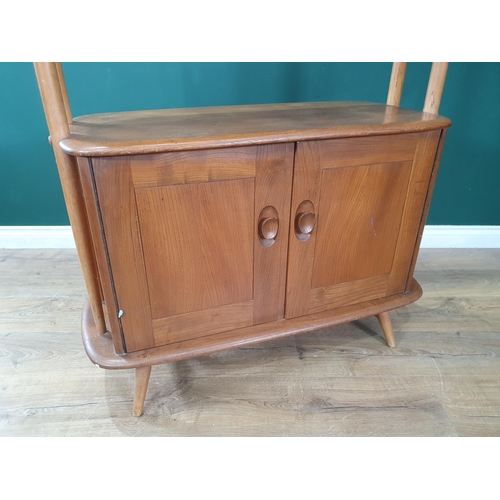 50 - A light elm Ercol 'Giraffe' Room Divider fitted two doors to base, label to inside of cupboard door,... 