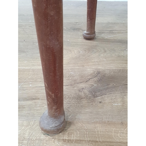 506 - An antique mahogany Cricket Table on turned supports and pad feet 2ft 1in H x 1ft 11in D (R4)