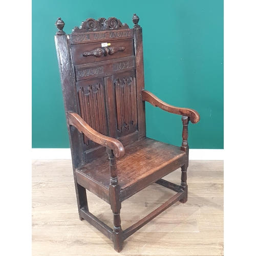 520 - An oak Armchair in the 17th Century style with applied linen fold panels 4ft 2in H x 2ft 3in W (R4)