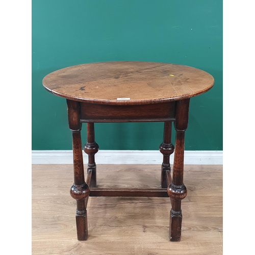 523 - A circular oak Occasional Table on turned column and ball supports united by H-stretcher 2ft 6in D x... 