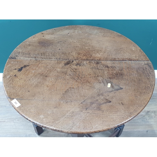 523 - A circular oak Occasional Table on turned column and ball supports united by H-stretcher 2ft 6in D x... 