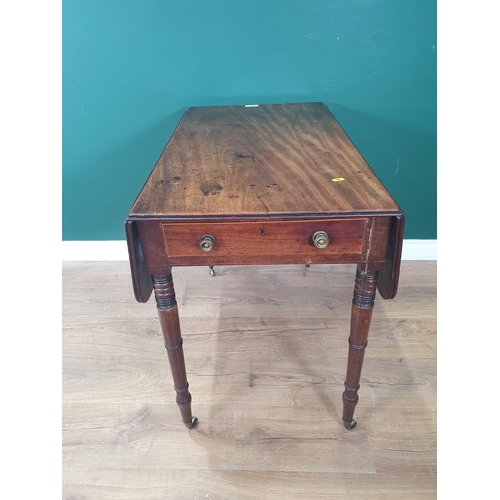 568 - A 19th Century mahogany Pembroke Table fitted end drawer and dummy drawer raised on turned supports ... 