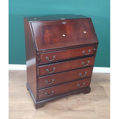 571 - A reproduction mahogany Bureau, the fall front enclosing pigeon hole and drawer interior and inset w... 