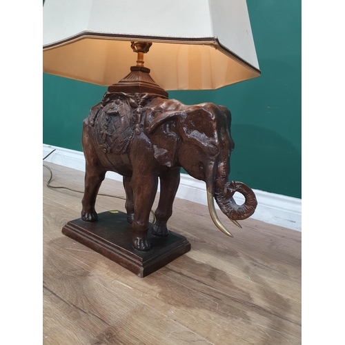 582 - A bronze effect Table Lamp and shade in the form of an elephant 2ft 5in H, passed PAT (R4)