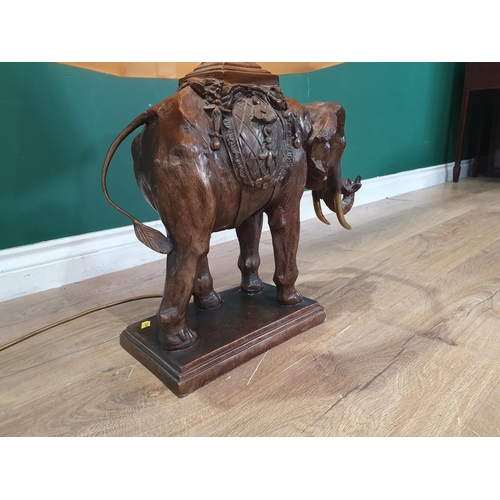 582 - A bronze effect Table Lamp and shade in the form of an elephant 2ft 5in H, passed PAT (R4)