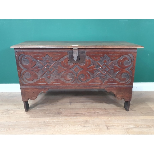 590 - An 18th Century oak six plank Chest with moulded lid above carved front 3ft 3in W x 1ft 11in H (R6)