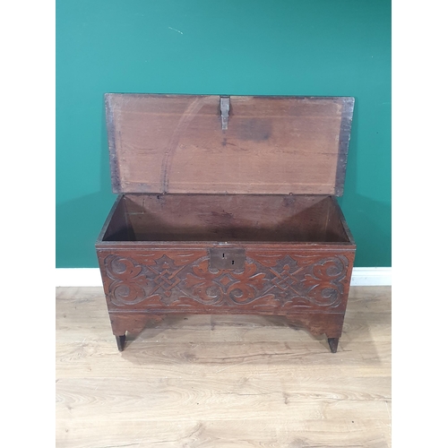 590 - An 18th Century oak six plank Chest with moulded lid above carved front 3ft 3in W x 1ft 11in H (R6)