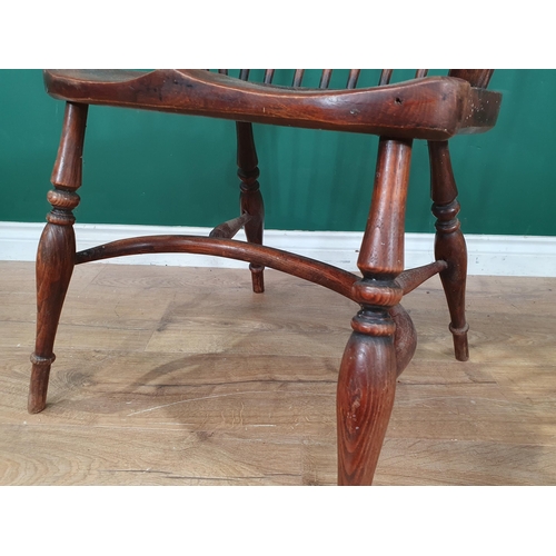 606 - A 19th Century ash Windsor Elbow Chair on turned supports united by crinoline stretcher 3ft 2in H x ... 