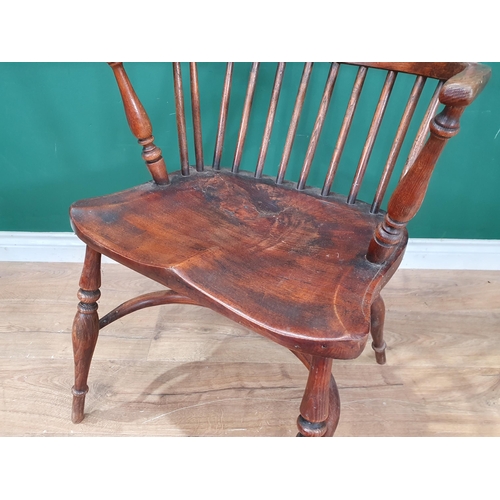 606 - A 19th Century ash Windsor Elbow Chair on turned supports united by crinoline stretcher 3ft 2in H x ... 