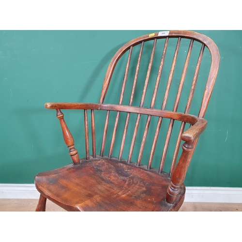 606 - A 19th Century ash Windsor Elbow Chair on turned supports united by crinoline stretcher 3ft 2in H x ... 