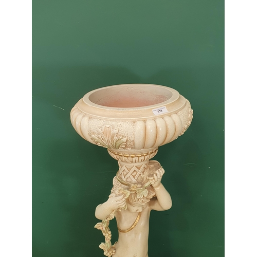 619 - A modern Jardinere with cherub support on circular base with scroll supports 4ft 6in H x 1ft 4in D (... 