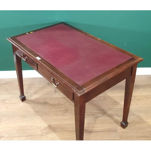 659 - A reproduction mahogany Writing Table with inset writing surface, above pair of fitted drawers, rais... 