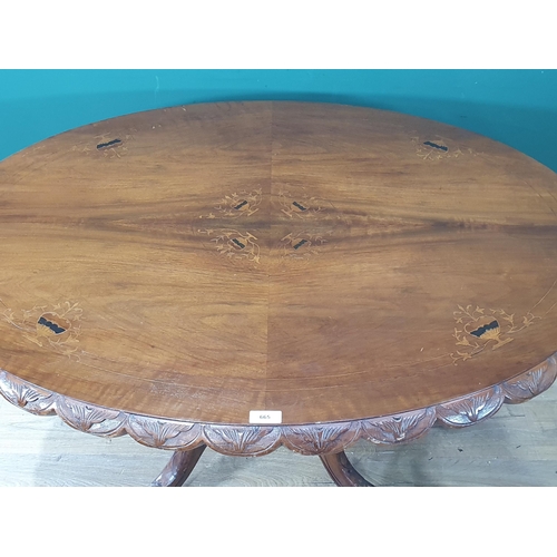 665 - A Victorian oval tilt top Breakfast Table, the top with flowering urn designs, raised on turned colu... 