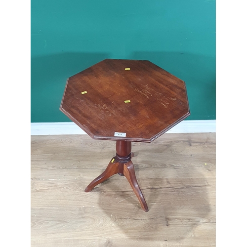 679 - A mahogany octagonal topped Occasional Table on turned column and tripod base, 2ft 3