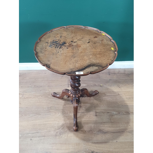 680 - A Victorian walnut Pillar Table with piecrust top on twisted column and tripod base 2ft 4in H x 2ft ... 