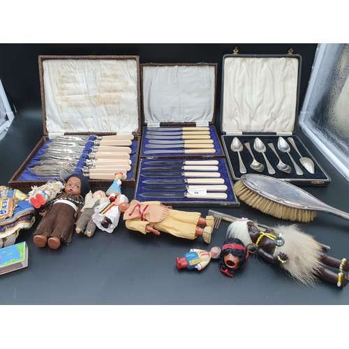 69 - A silver mounted Brush, four boxes of plated Cutlery, and a quantity of Dolls, etc