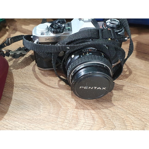 708 - A quantity of Cameras and accessories including A Canon AT-1, a Pentax P30n, a Helina Perfect twin L... 