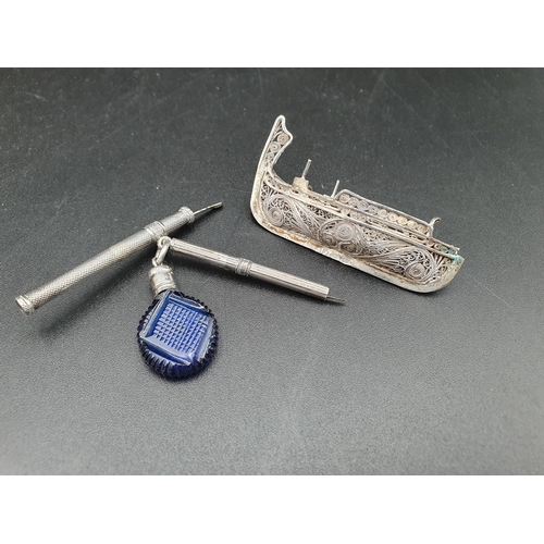 90 - A miniature blue glass Scent Bottle, Extending Pick and Spatula and filigree Gondola