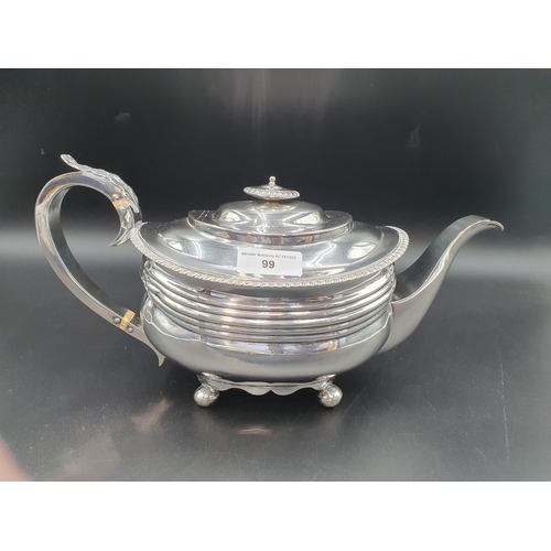 99 - A George III silver boat shape Teapot with gadroon rim on ball feet, London 1818, 560gms