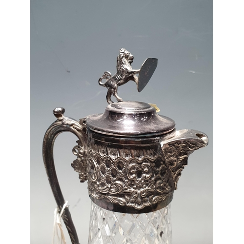 318 - A cut glass Ewer with plated lid and a Decanter and stopper (R5)