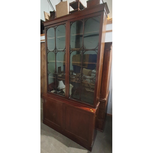 462 - A 19th Century mahogany glazed Bookcase with pair of doors with applied moulded corner brackets, the... 