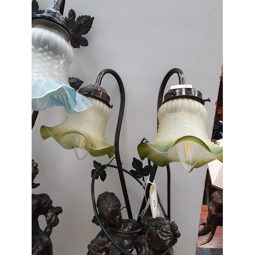 572 - Two bronze effect Table Lamps with figural design of cherubs and maidens with glass shades 2ft 10in ... 