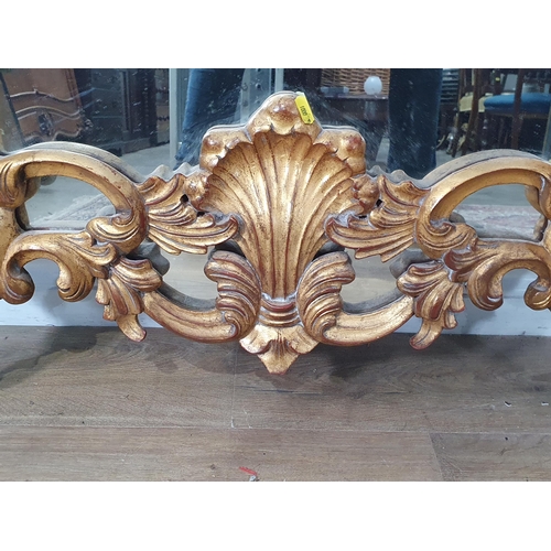 713 - An ornate gilt framed Wall Mirror with acanthus leaf design 4ft 11in H x 2ft 11in W (R11)