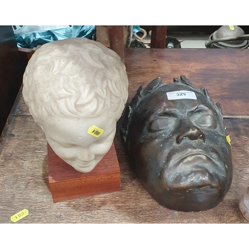 329 - A bronze effect pottery Mask 9 1/2in and a mounted resin Head, 9in H