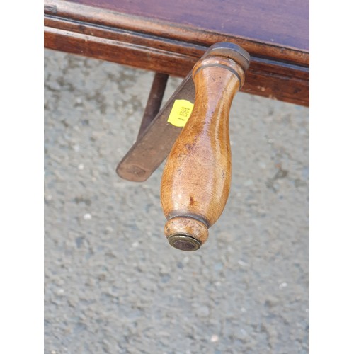 449 - A late 19th Century walnut extending Dining Table on turned supports and casters