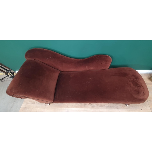 566 - A Victorian Chaise Longue with brown upholstery mounted on turned supports and ceramic casters 6ft 6... 