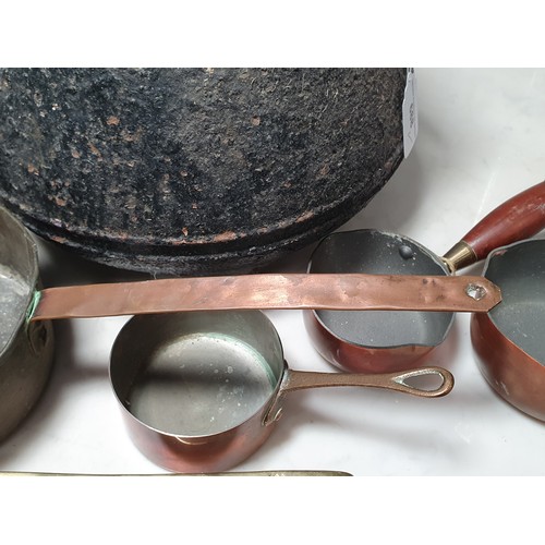 688 - An antique two handled Cooking Pot, two brass Pans with geometric pattern handles, a copper two hand... 