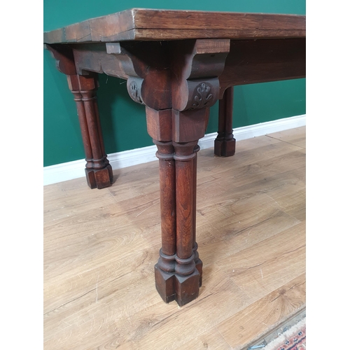 917 - An oak Library Table with five plank top raised on cluster column supports 3ft 9in W x 2ft 5in H (R4... 