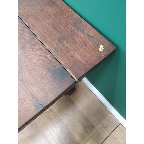 917 - An oak Library Table with five plank top raised on cluster column supports 3ft 9in W x 2ft 5in H (R4... 