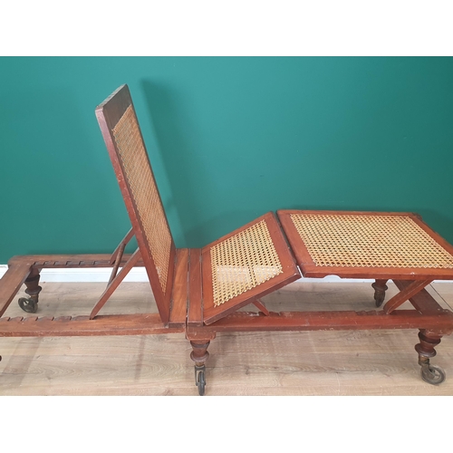 754 - A Campaign Day Bed stamped Robinson's & Sons, Ilkley, Patent, with adjustable cane panels, raised on... 