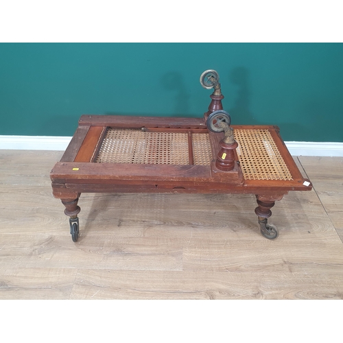 754 - A Campaign Day Bed stamped Robinson's & Sons, Ilkley, Patent, with adjustable cane panels, raised on... 