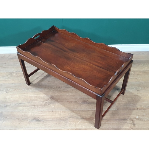 762 - A mahogany Butler's Tray with shaped gallery, on a later Stand with fluted square supports having H ... 