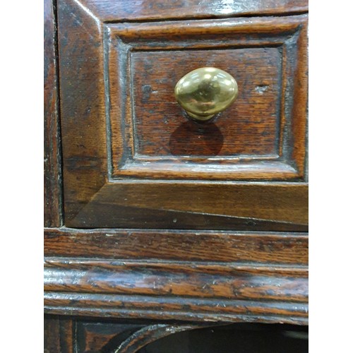 830 - A Charles II oak Dresser Base, fitted four moulded drawers on turned and squared supports and square... 