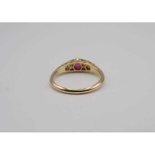 166 - A Victorian Ruby and Diamond Ring claw-set oval-cut ruby between trios of pavé-set old-cut diamonds ... 
