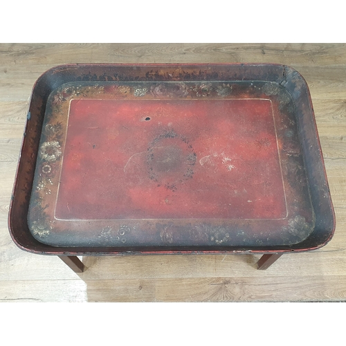 44 - A Regency red lacquered papier maché Tray raised on later square leg stand 2ft 6in W