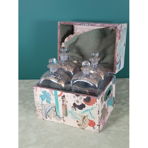 556 - A 19th Century Dutch painted Decanter Box with hinged cover enclosing four Decanters and Stoppers wi... 