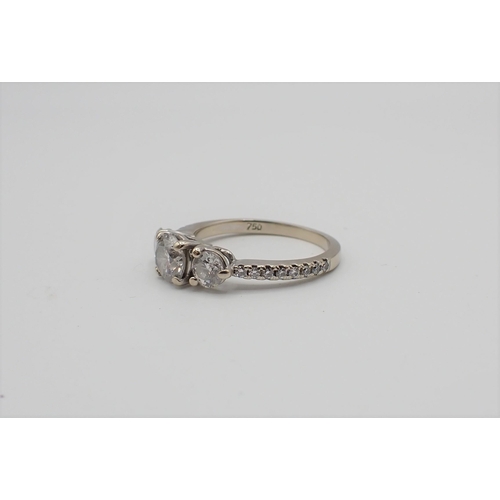 169 - A Diamond three stone Ring claw-set brilliant-cut stone, est 0.65cts, between two smaller stones, fu... 