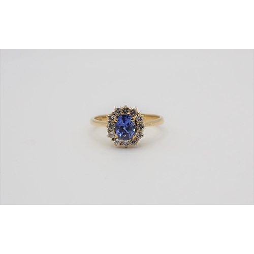 172 - A Sapphire and Diamond Cluster Ring claw-set oval-cut sapphire within a frame of twelve brilliant-cu... 