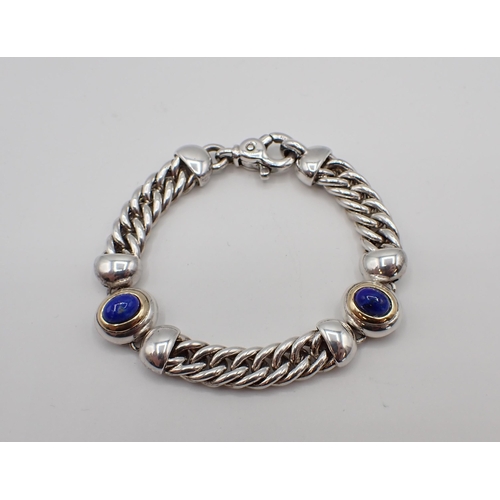 180 - Mappin & Webb: A silver, gold and Lapis Lazuli Bracelet the flattened curb linking interspaced with ... 