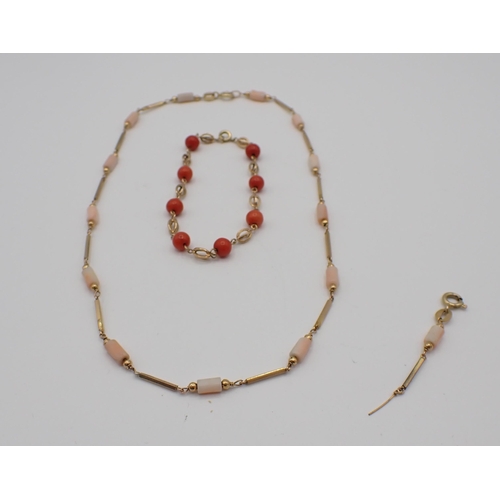 187 - A 9ct gold and Coral Necklace the long link chain with coral baton spacers with extra links and a Co... 
