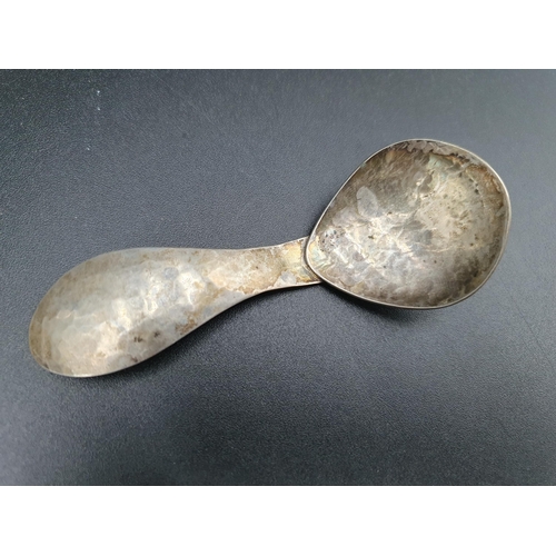 101 - A modern designer silver Caddy Spoon with hammered design, London 1991, maker: FCD