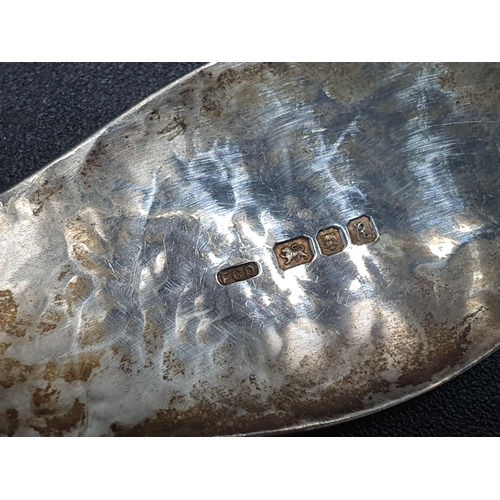 101 - A modern designer silver Caddy Spoon with hammered design, London 1991, maker: FCD