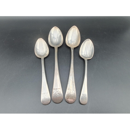 103 - Two George III silver Table Spoons and two Dessert Spoons, old English pattern, engraved crests, var... 