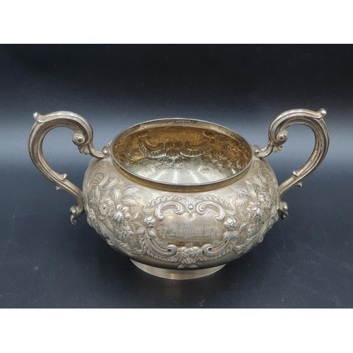 105 - A Victorian silver two-handled Sugar Bowl and Milk Jug with floral and scroll embossing, London 1871... 