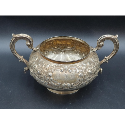 105 - A Victorian silver two-handled Sugar Bowl and Milk Jug with floral and scroll embossing, London 1871... 